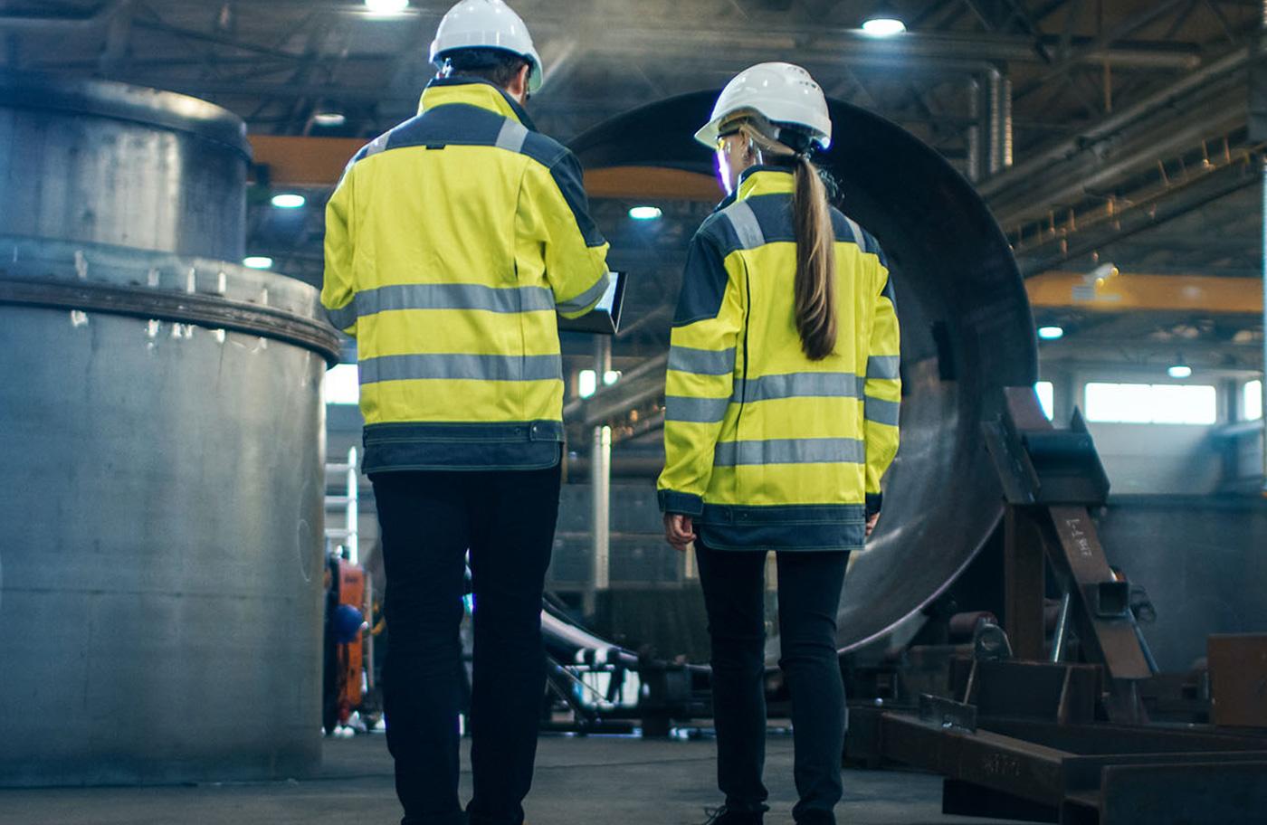 Workers discussing specs of a build for Mk2 Recruitment