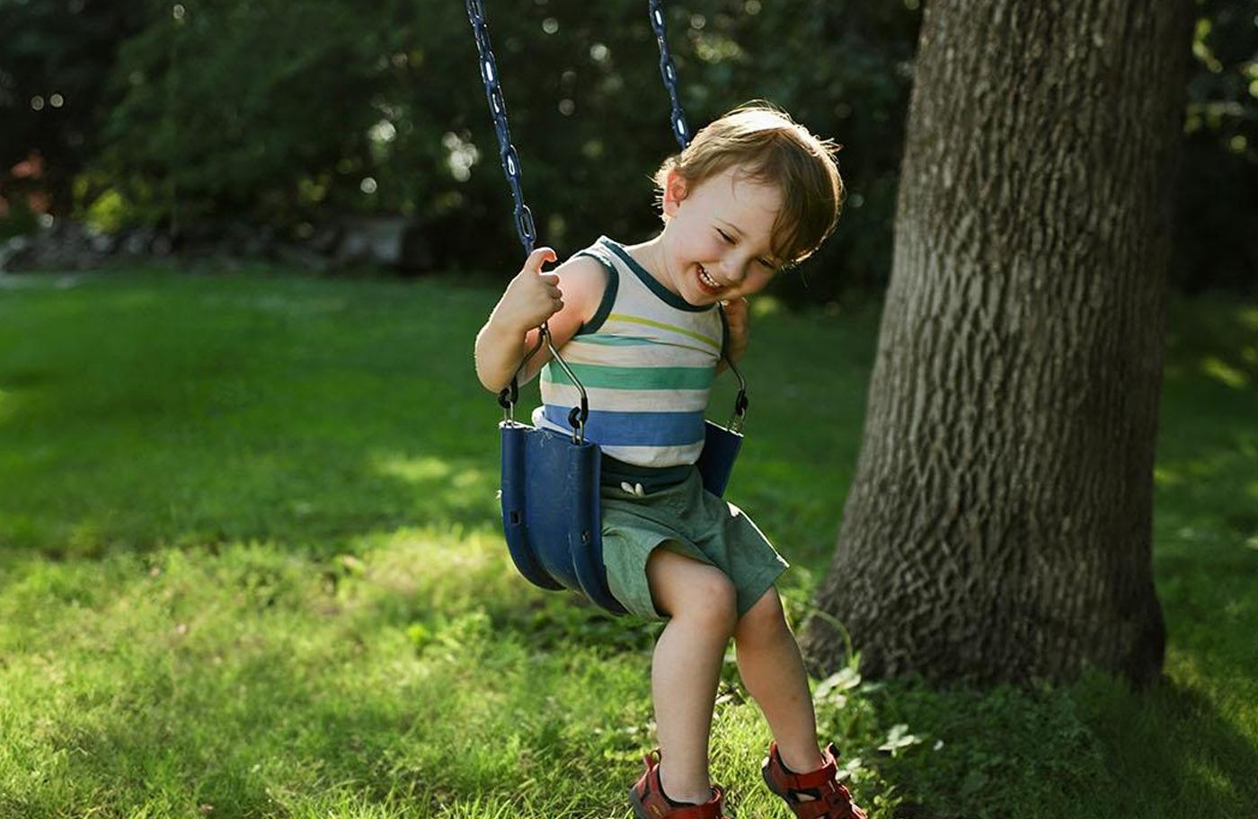 Child enjoying a swing at a park at Mooringe Mews